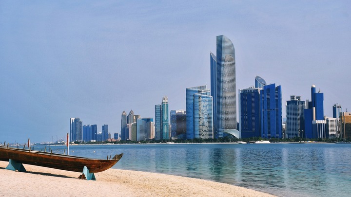 Abu Dhabi skyline with beach in foreground