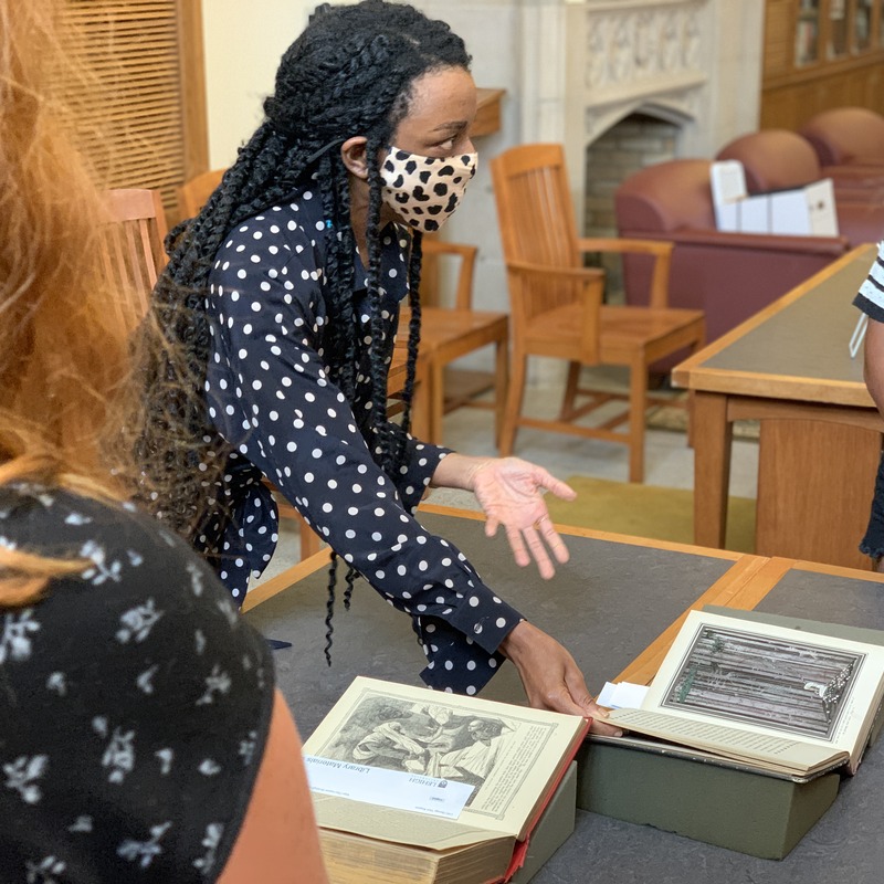 Jasmine Woodson showing students fairy tale books