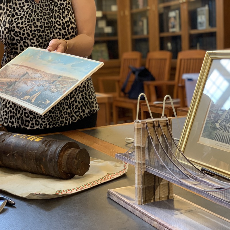 Lois Black describes print showing opening day ceremonies